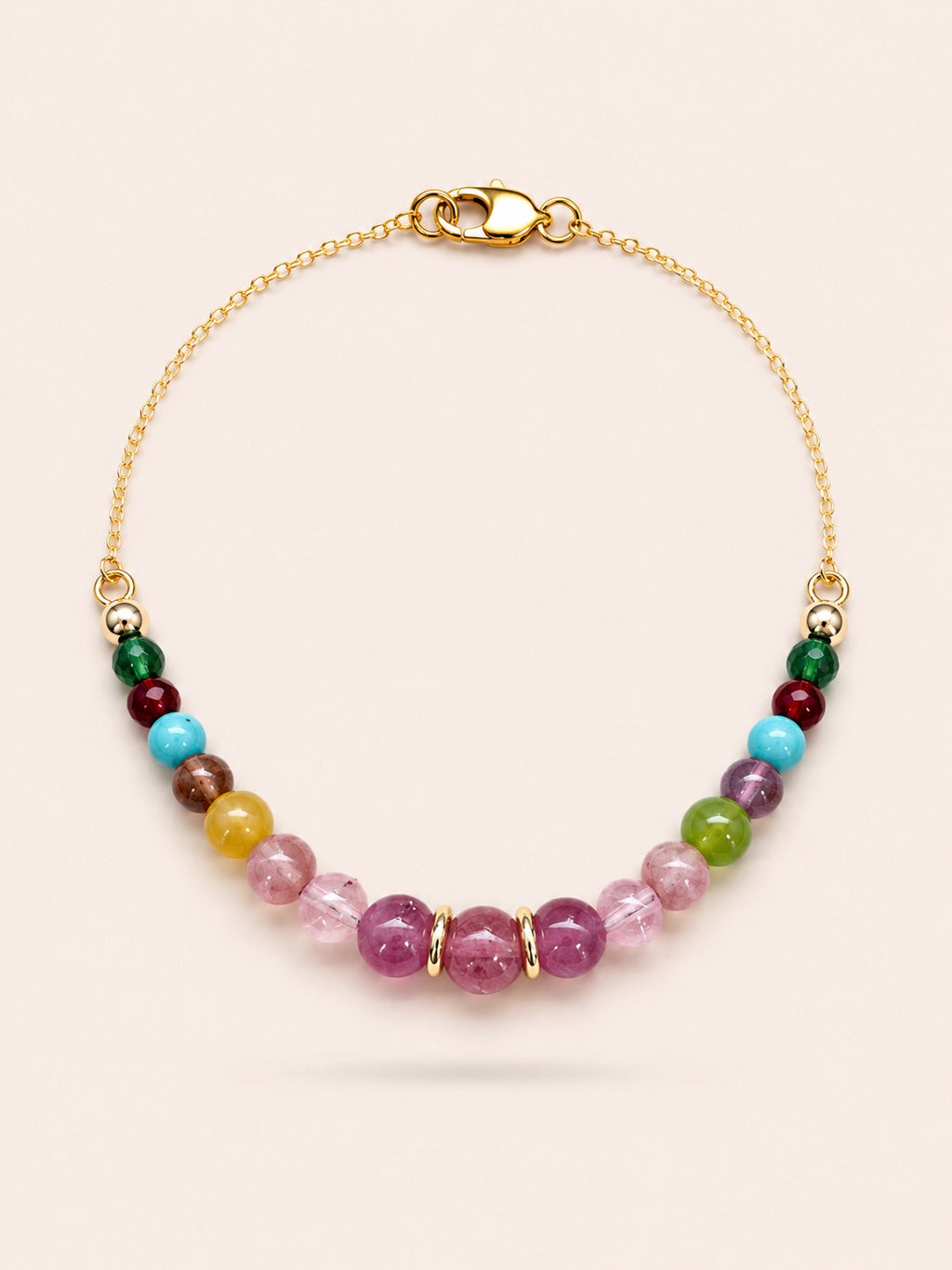 Fleur de Saison natural pink tourmaline, jade and turquoise gemstone bracelet with 18K gold coated sterling silver chain on Pearled Ivory background.