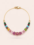 Fleur de Saison natural pink tourmaline, jade and turquoise gemstone bracelet with 18K gold coated sterling silver chain on Pearled Ivory background.