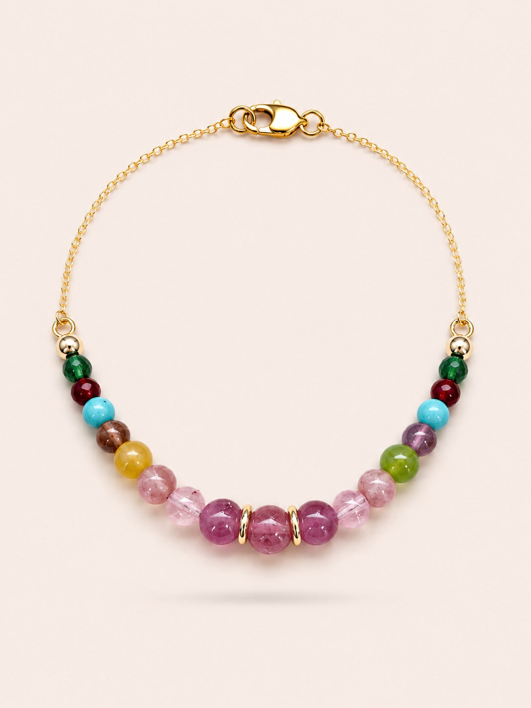 Fleur de Saison natural pink tourmaline, jade and turquoise gemstone bracelet with 18K gold coated sterling silver chain on Pearled Ivory background.
