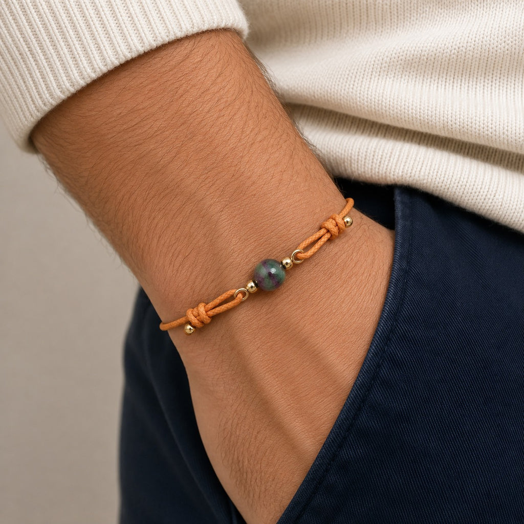 Petit Soleil 7mm Watermelon Tourmaline orange cord bracelet worn on wrist.