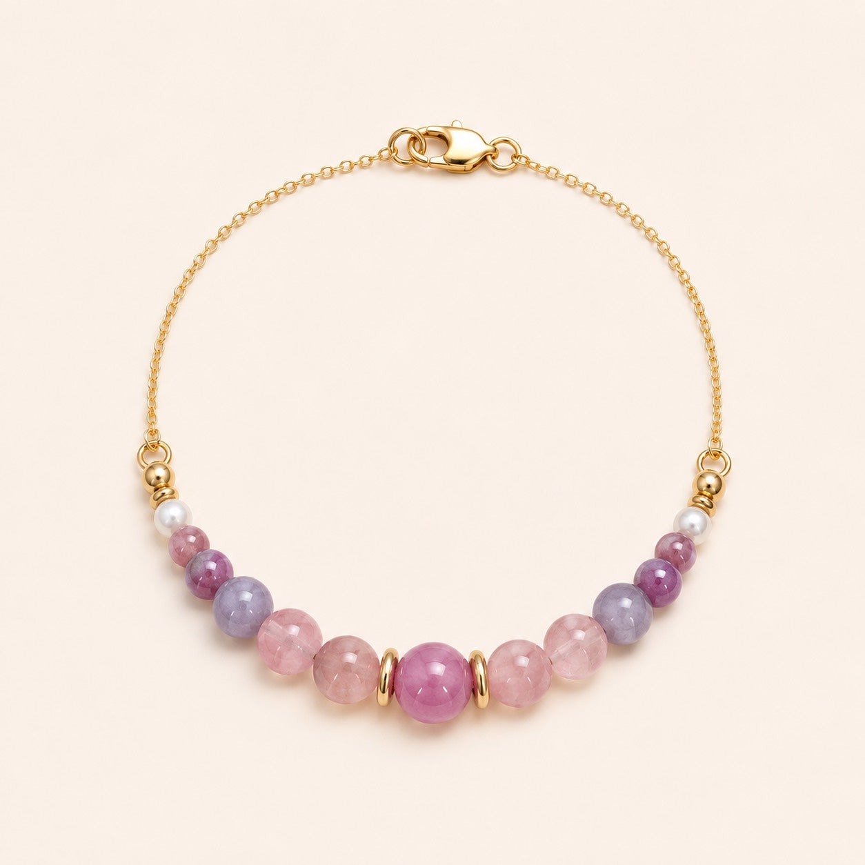 Handcrafted natural pink tourmaline bracelet with freshwater pearls and 18K gold vermeil by Sense Jewelry.