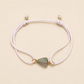 Secret Garden natural green and blush tourmaline bracelet with pale pink cord and gold details by Sense Jewelry
