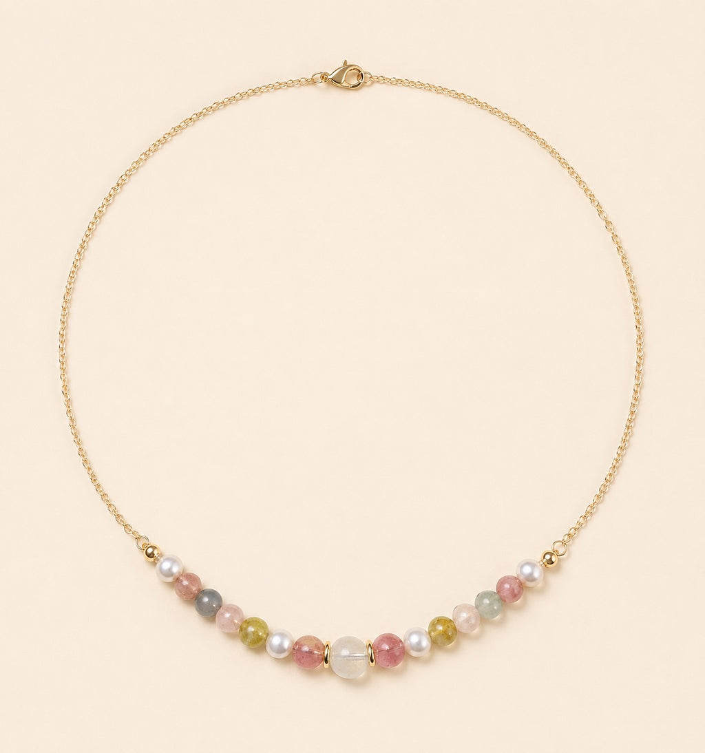 Blooming necklace featuring pastel tourmaline, jade and freshwater pearls with a delicate 18K gold-plated chain by Sense Jewelry.