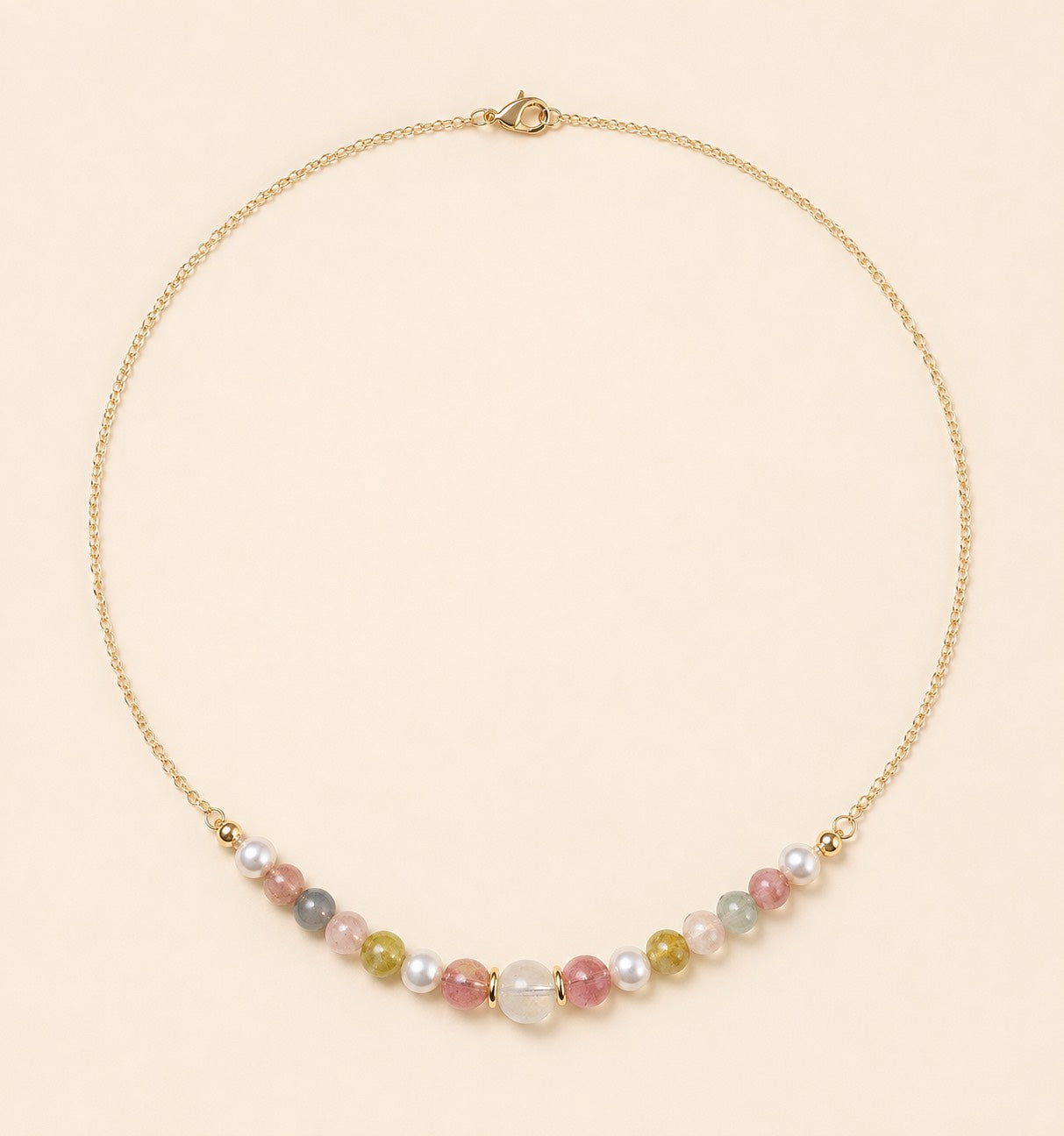 Blooming necklace featuring pastel tourmaline, jade and freshwater pearls with a delicate 18K gold-plated chain by Sense Jewelry.