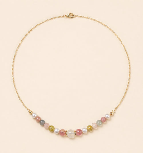 Blooming necklace featuring pastel tourmaline, jade and freshwater pearls with a delicate 18K gold-plated chain by Sense Jewelry.