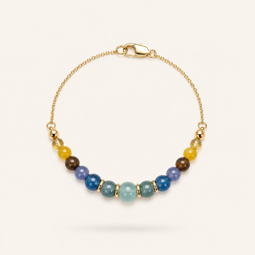Soleil et Mer bracelet by Sense Jewelry featuring natural Aquamarine, Blue Tourmaline and Yellow Jade gemstones on an 18K gold-plated sterling silver chain.