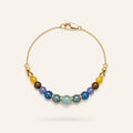 Soleil et Mer bracelet by Sense Jewelry featuring natural Aquamarine, Blue Tourmaline and Yellow Jade gemstones on an 18K gold-plated sterling silver chain.