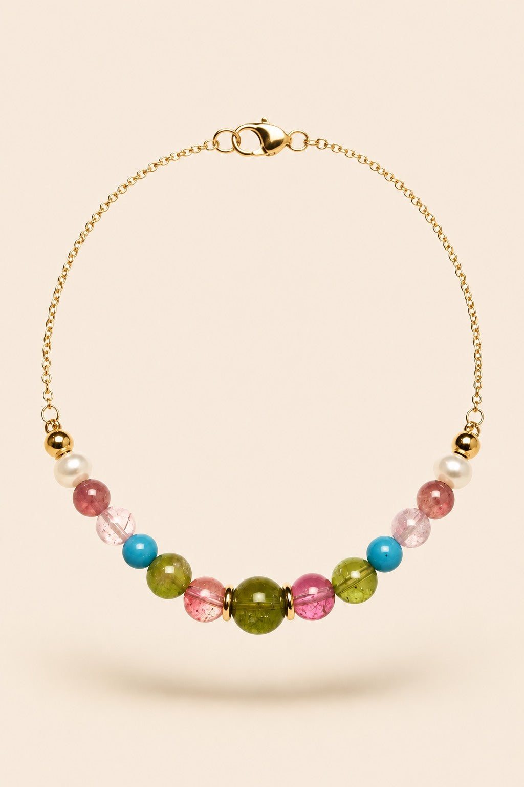 Summer Parties Signature Series bracelet featuring pink and green tourmaline, turquoise, pearl and gold-tone details.