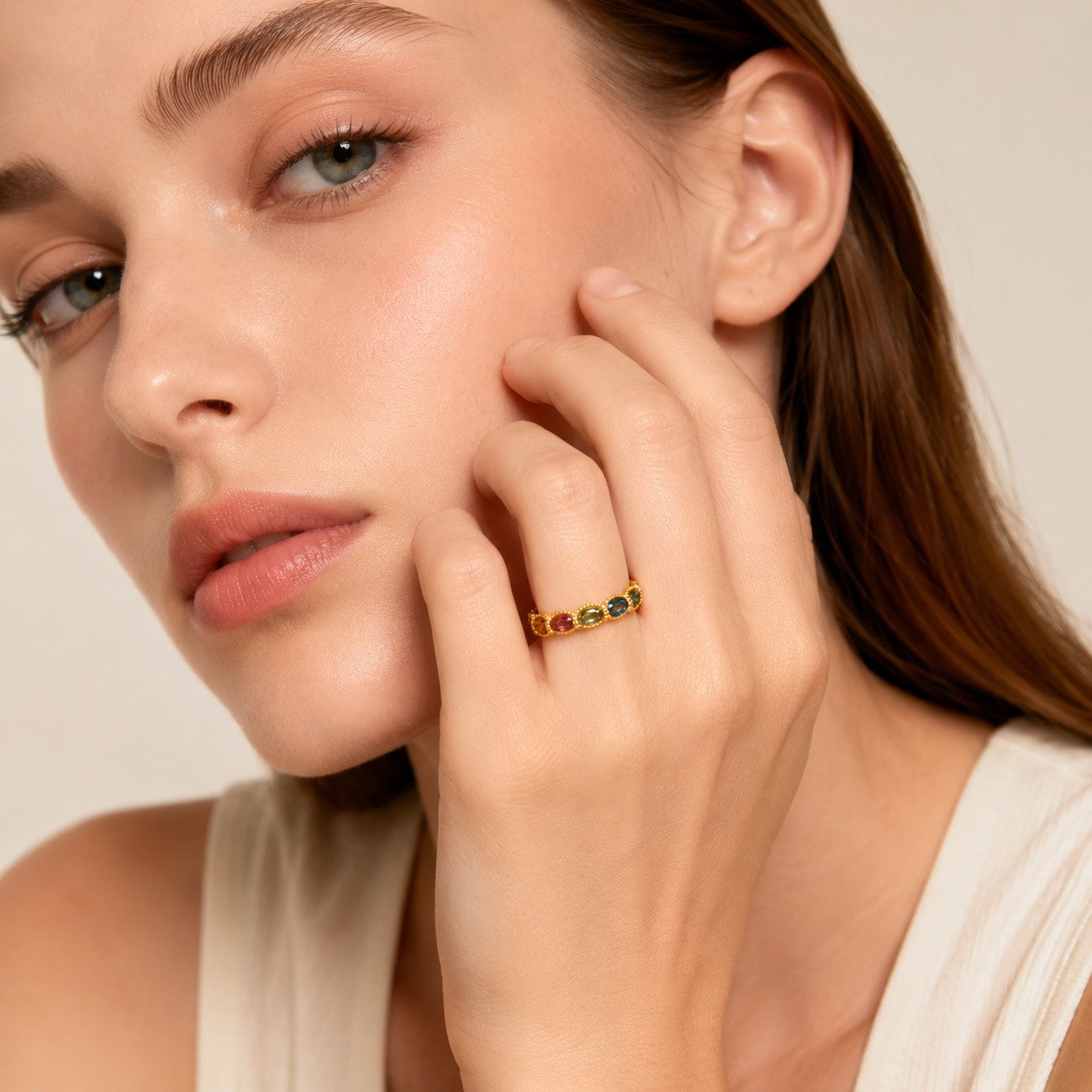 Woman wearing Rainbow on Your Fingertip multicolor tourmaline eternity ring by Sense Jewelry