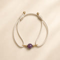 Violet Moon natural purple pink multicolor tourmaline gemstone bracelet with ivory white cord and gold-tone details by Sense Jewelry